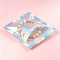 Accessoires pour sacs en plastique laser de qualité supérieure, boucles d'oreilles, sachet holographique à fermeture éclair, pochette plate pour emballages de bijoux