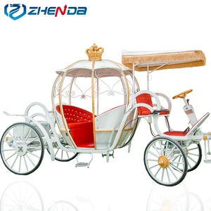 Charrette de Cendrillon électrique blanche et rouge avec toit en forme de couronne pour mariages, événements et fêtes à thème - Product Image 1