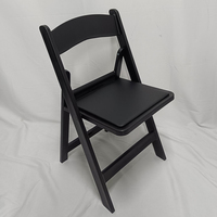 Chaise pliante rembourrée en résine PP noire empilable pour événements, vente en gros