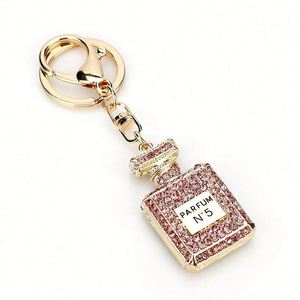 Porte-clés créatif en métal avec strass, pendentif de voiture orné de diamants, flacon de parfum imprimé en émail, pendentif de sac pour femme - Product Image 2