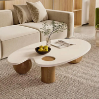 Table basse ovale en bois massif blanc nordique, finition brillante Wabi-Sabi, forme irrégulière, taille personnalisable, luxe avec trois pieds