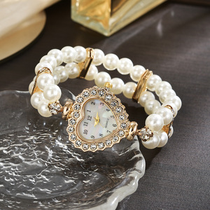 Stylish <b>watch</b> featuring a heart-shaped dial fully set with rhinestones and pearls, a petite strap, and a beautiful double-row pe - Product Image 4