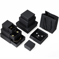 Coffret de collection de luxe personnalisé Seismo noir avec LED, comprenant boutons de manchette, clous de chemise, pièces de monnaie, cartes souvenirs, bougies, emballages rigides recyclables