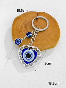 Vente en gros de porte-clés, breloques et pendentifs amulettes œil de protection, ornés de strass, motifs papillon, éléphant, cœur, et avec pompon, style œil de protection turc, à suspendre - Product Image 4