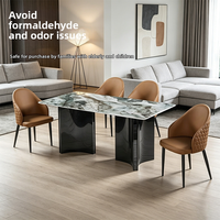 Ensemble de table et chaises de salle à manger modernes en gros avec plateau en pierre verte et base à panneaux angulaires pour l'approvisionnement des projets hôteliers et résidentiels