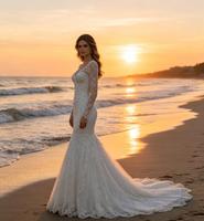 Robe de mariée sirène élégante en dentelle ivoire à manches longues, décolleté cœur, dos en V, appliques florales, traîne chapelle