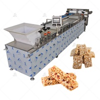 Machine mélangeuse industrielle automatique pour la fabrication de pralines, nougats, barres de cacahuètes, granola, céréales, barres protéinées, ligne de transformation alimentaire