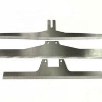 Top We Factory Supply Couteaux dentelés en forme de T en acier inoxydable sûrs pour l'industrie des emballages alimentaires