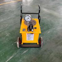 Machine portable de fendage de roches adaptée à la déchiquetage des déchets de carrière, à la segmentation du granit et de la pierre bleue