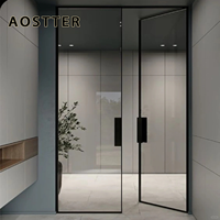 Porte battante AOSTTER noire en aluminium mince avec vitrage transparent pleine hauteur et charnière dissimulée pour un intérieur minimaliste