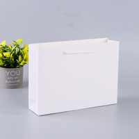 High Quality Beautiful White Cardboard Luxury Recyclable Biodegradable Paperboard Bag Hand Length Handle Supermarket Promotion