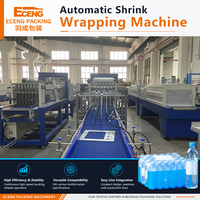 Machine d'emballage de cartons par enroulement avec colle thermofusible de type goutte