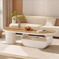 Table basse ovale en pierre frittée aspect marbre, plateau en métal brossé, rangement multi-tiroirs, luxe léger pour maison, hôtel, villa