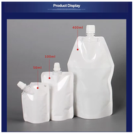 Vente en gros de pochette Doypack en plastique transparent liquide BOPP étanche personnalisée avec bec pour le stockage de l'eau de jus de bière