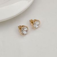Anting-anting stud logam wanita yang indah dengan gaya Eropa dan Amerika, mewah ringan, elegan, manis, bertahtakan rhinestones dan enamel berbentuk bunga.