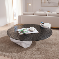 Table basse ronde en verre trempé à texture d'eau ondulée noire de luxe moderne avec pieds en colonne de marbre pour salon