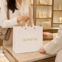 Sac cadeau de luxe personnalisé avec logo imprimé pour boutique de vêtements, recyclable, avec poignée en ruban, échantillon gratuit HONPAK