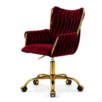 Fauteuil de détente en velours rouge, capitonné, dossier haut, siège pivotant réglable en hauteur, base en métal doré avec roulettes