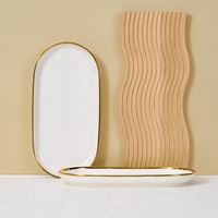Ensemble de bols et assiettes en céramique de luxe léger, créatif, avec bordure dorée électroplaquée, style nordique, pour la maison et le commerce extérieur