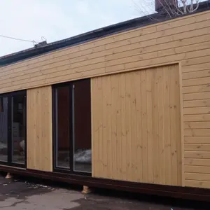 Modular wooden house with flat roof prefabricated beach windproof flat Roof Modern shockproof camping cabin made in China