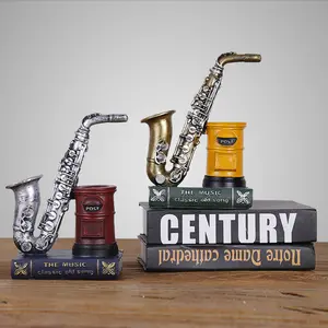 حاوية على شكل قلم لتصميم آلة موسيقية ساكسفون مبدعة ديكور منزلي حرف يدوية تماثيل طاولة من الراتنج