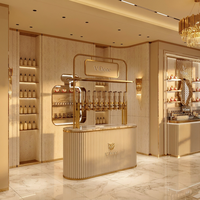 Kiosque de présentation de parfums modulaire personnalisé, bar à parfums mobile avec vitrine en verre éclairée par LED pour les magasins de vente de parfums