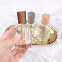 Flacon de parfum miniature de haute qualité 50 ml 1,7 oz Flacon de parfum en verre Cylindre Col à visser Flacon pulvérisateur avec bouchon en bois