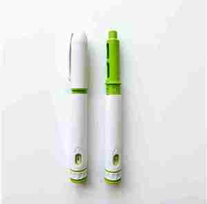 Stylo jetable 10mg avec petite fenêtre, design vert et blanc - Product Image 4