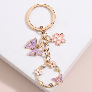 Lindo esmalte mariposa Sakura flor llavero hecho a mano aleación Zinc DIY joyería para mujeres niñas jardín llaveros amistad regalos - Product Image 5