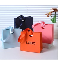 Sacs d'emballage carrés personnalisés de luxe faits à la main pour bijoux, sacs créatifs orange avec poignées pour l'emballage de montres