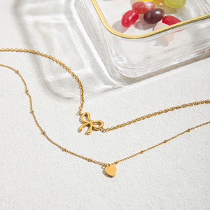 Collar con colgante de lazo y corazón de acero inoxidable y oro de 18 quilates con diseño delicado para regalo - Product Image 4