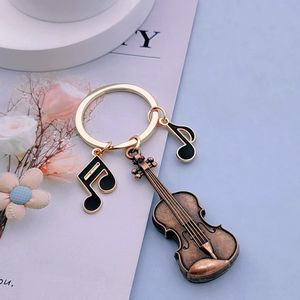 Llavero con nota musical de violín vintage, colgante para mochila, joyería de moda europea y americana, regalo creativo - Product Image 3