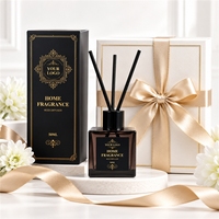 Diffuseur de parfum d'ambiance de luxe en verre noir avec logo personnalisé, décorations à pompons et bâtonnets en rotin – Fabrication en usine