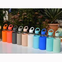 Bouteille d'eau en verre transparente personnalisée de 600 ml avec manchon en silicone pour le sport – Vente en gros