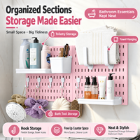 Ensemble d'organisateurs de rangement pour salle de bain en plastique rose, panneau mural sans perçage pour l'organisation des articles de toilette.