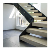Escaliers préfabriqués en acier inoxydable avec garde-corps en verre pour une utilisation intérieure/extérieure dans les halls d'appartements.