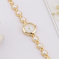 Montre-bracelet à quartz personnalisée à la mode et simple avec bracelet en perles pour dames