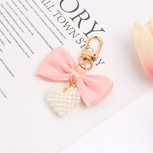 Nouveau papillon noeud or porte-clés pendentif créatif perle creux coeur accessoires étui pour écouteurs sac décoration - Product Image 6