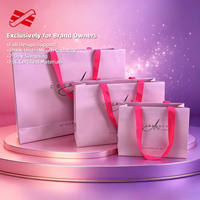 Sac shopping en papier rose personnalisé avec poignée en ruban satiné en trois tailles pour la vente au détail de cosmétiques