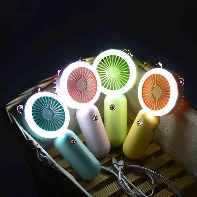 Customized Mini Hand Fan Children And Ladies Summer Air Cooler Wrist Hanging Portable Fan Night Light Usb Rechargeable Fans