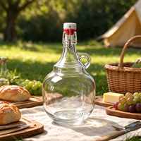 Bouteille en verre transparente à grande capacité avec couvercle basculant et poignée pour huile d'olive extra vierge et sirop