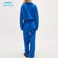 Combinaison sportive pour femme Col classique Décolleté avant Combinaison de vol zippée Poches de poitrine Fabrication structurée