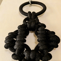 Décoration murale en corde noire à nœuds épais et pompons pour les marques de décoration intérieure et les détaillants transfrontaliers