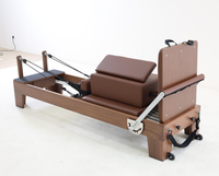 Machine de Pilates Reformer en bois de noyer avec plateforme de saut et boîte d'assise pour équipement d'exercice à domicile