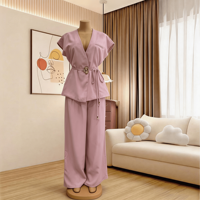 Ensemble élégant deux pièces pour femme, vente en gros d'usine, décontracté d'été, sans manches, avec ceinture, gilet et pantalon large, couleur unie, idéal pour le bureau