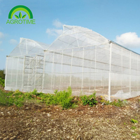 Serre commerciale avec système de culture hydroponique Serre à tunnel en poly agricole à travée multiple pour l'extérieur