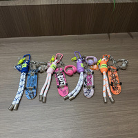 Mini skateboard à doigts porte-clés, pendentif graffiti pour sac, breloque en corde tressée, pendentif skateboard coloré pour sac à dos, vente en gros