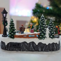 Maisons de village de Noël en résine MELODY avec scène LED animée, patineurs rotatifs et musique, pour usage intérieur, décoration de Noël