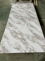Prix de gros Feuille de marbre UV en PVC à haute brillance Panneau mural en plastique à motif de marbre artificiel au design moderne