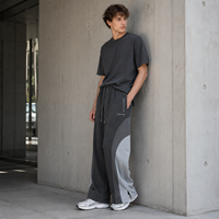 Pantalon de survêtement en molleton français à blocs de couleur personnalisés, coupe large avec ourlet fendu, pour hommes, marque privée pour tenues streetwear